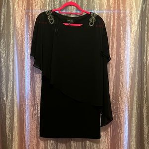 Black A-line dress with sheer sleeve over lay